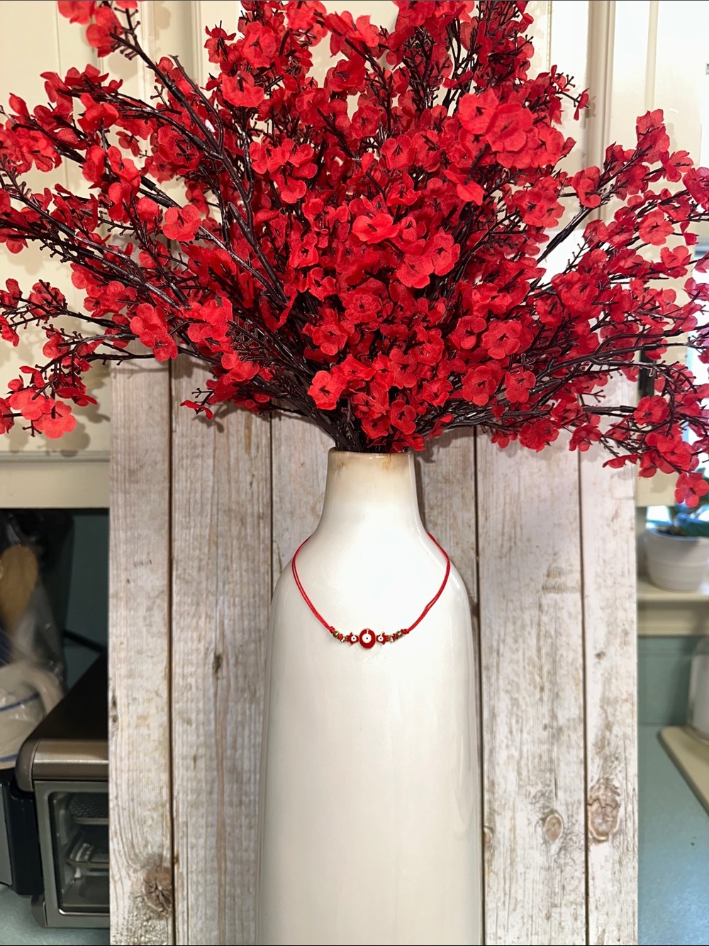 Red Floral Cherry Blossoms in White Decorative Vase